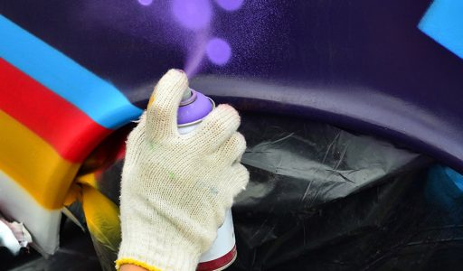 a-hand-with-a-spray-can-that-draws-a-new-colorful-TBDVR3V.jpg