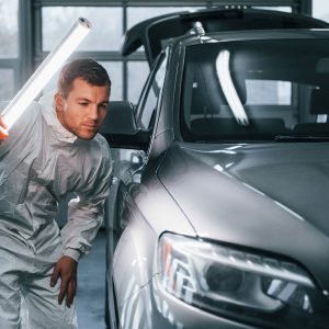 silver-colored-car-man-in-uniform-is-working-in-th-KDHZA26a.jpg